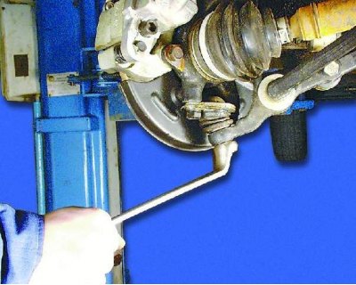 1. Raise and support the front of the vehicle. Remove the wheel.