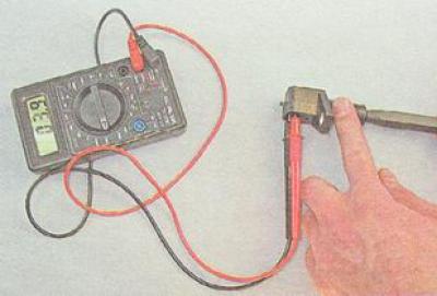 2. Quickly move the blade of the screwdriver near the end of the crankshaft position sensor, while…