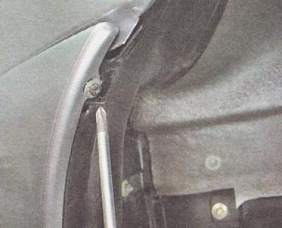 b) self-tapping screw for the upper connection of the front bumper with the fender liner;