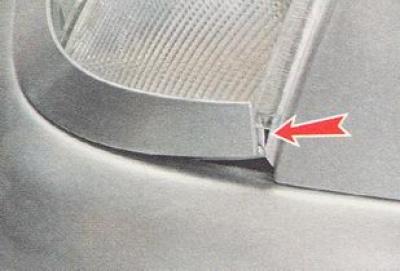 8. Having pressed the unfastened headlight upwards, carefully, trying not to damage the paint on…