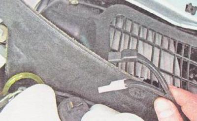9. Disconnect the connectors from the terminals of the rear window washer electric pump.