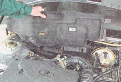 12. Remove the right part of the engine compartment trim.