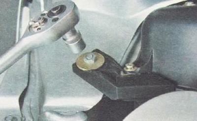 22. Using a 10 mm socket wrench, unscrew the nut of the right heater mount.