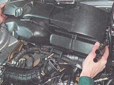23. Move the heater housing forward and upward and remove it from the car.