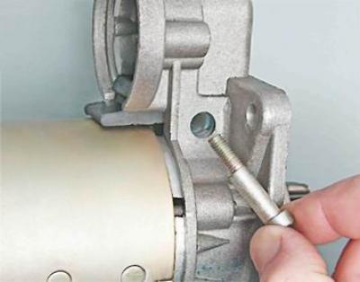 7. Remove the axle from the cover.