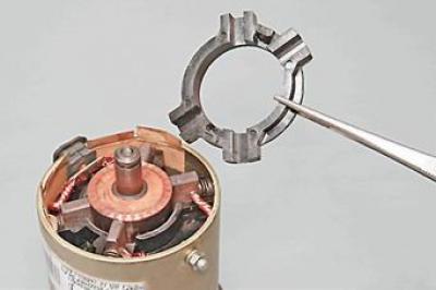 20. Remove the outer part of the brush guide.