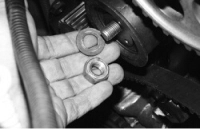 5. …and remove the washer, and then the tension roller from the stud.