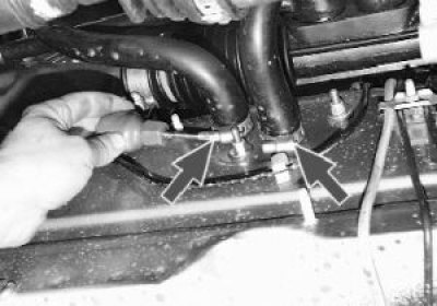 6. Unscrew the two nuts securing the heater tap.