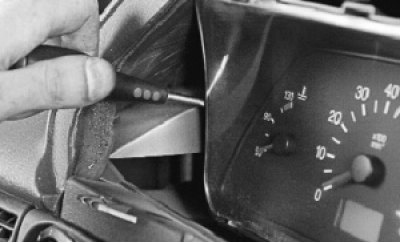 4. Remove the instrument cluster from the hole in the instrument panel.