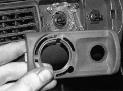 6. Loosen the instrument panel lighting switch mounting nut