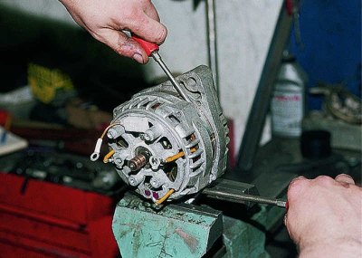 Using a sharp scriber or paint, mark the relative positions of the covers and the stator for…