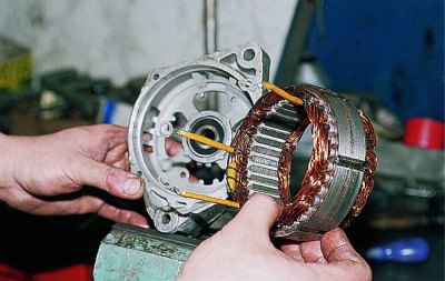 Using a screwdriver, pry the stator...
