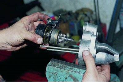 Using a soft metal punch, we knock out the drive shaft..