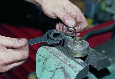 We use pliers to open the retaining ring,…